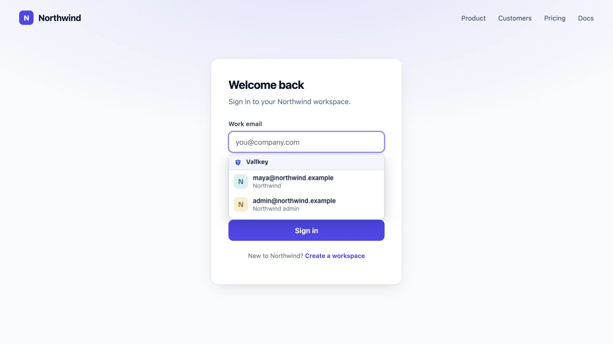 A company's sign-in page in the browser, with Vallkey's menu under the email field offering two saved logins.